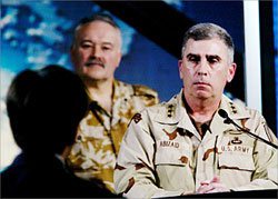 A US journalist poses a question to General John Abizaid