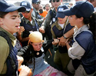 Protesters are being hauledonto buses and taken away 