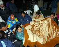 Relatives sit through the nightawaiting news of the miners