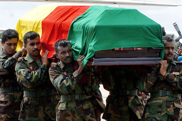 Sri Lankan sailors carry the coffin at the Palaly Air Base, prior to the funeral of the slain Tamil legislator Nadarajah Raviraj held in the Jaffna peninsula