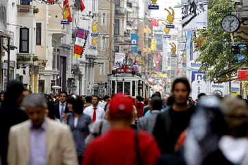 Pedestrians walk at Istiklal street in Istanbul, Turkey