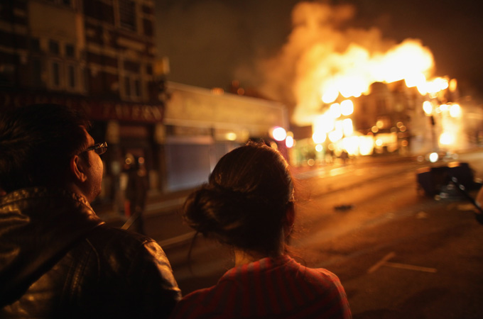 onlookers at a london riot scene