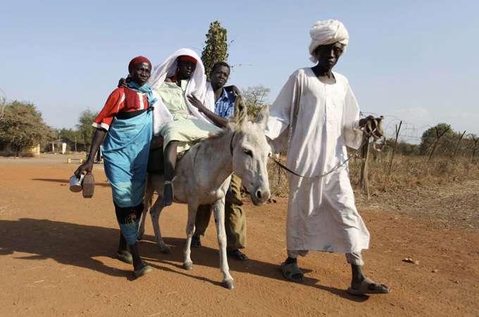 A Sudanese woman from the war-torn Blue Nile state leaves a clinic at South Sudan''s Doro refugee camp December 10, 2011. More than 80,000 Sudanese have sought refuge in South Sudan from clashes between government forces and insurgents on the northern side of the poorly-marked and tense border, according to the United Nations. Picture taken December 10, 2011. REUTERS