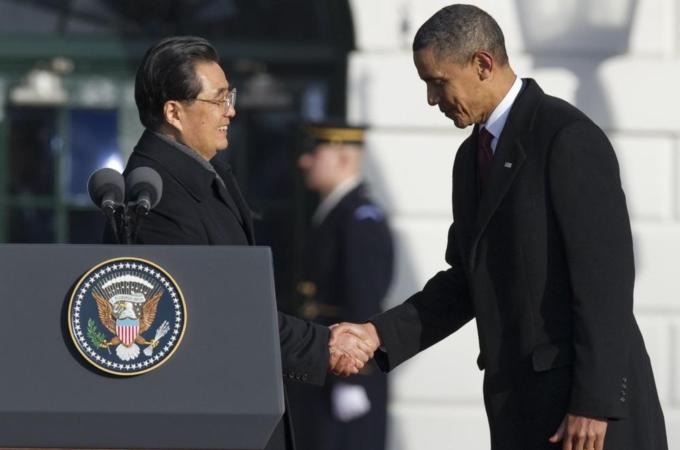 US President Barack Obama shakes hands w