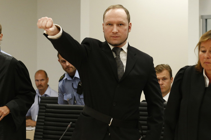 Breivik gestures as he arrives at Oslo court