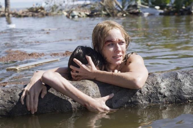 Publicity photo of actors Tom Holland and Naomi Watts are shown in a scene from the film