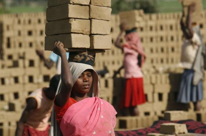 Women labourers work in a brick factory on International Women''s Day in Jirania village