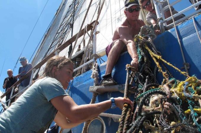 Handout photo of crew members lifting out ocean debris on board the Ocean Voyages Institute''s ship, the Kaisei, in the Pacific