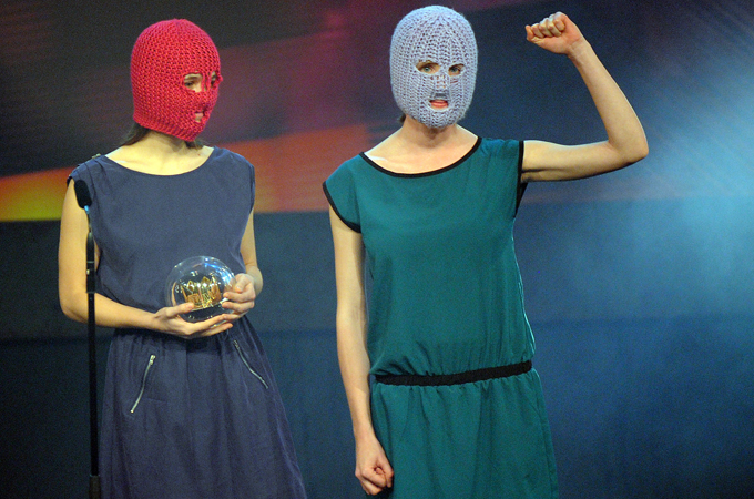 Pussy Riot members receive a special award during the 1Live Crown Awards 2012 in the Centennial Hall in Bochum, Germany, in December, 2012 [Henning Kaiser/EPA]