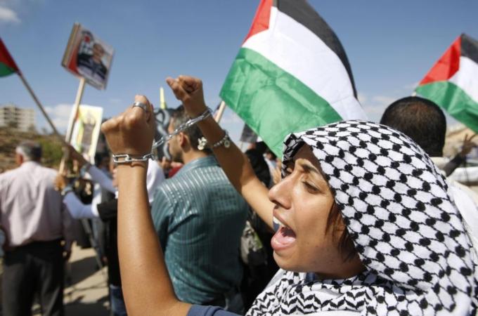 A Palestinian takes part in a protest outside Ofer prison to show solidarity with Palestinian prisoners held in Israeli jails