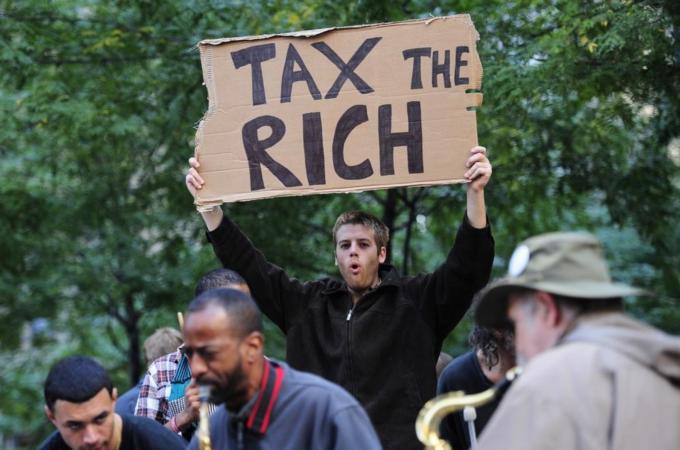 Occupy Wall Street participants carry on