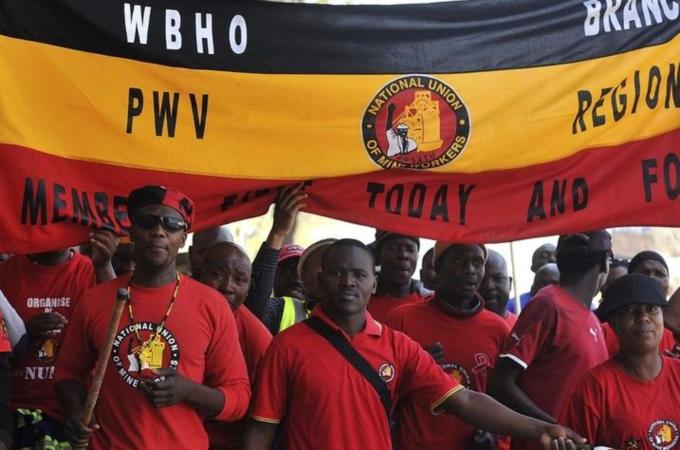 Members of the National Union of Mineworkers take part in a strike in Johannesburg