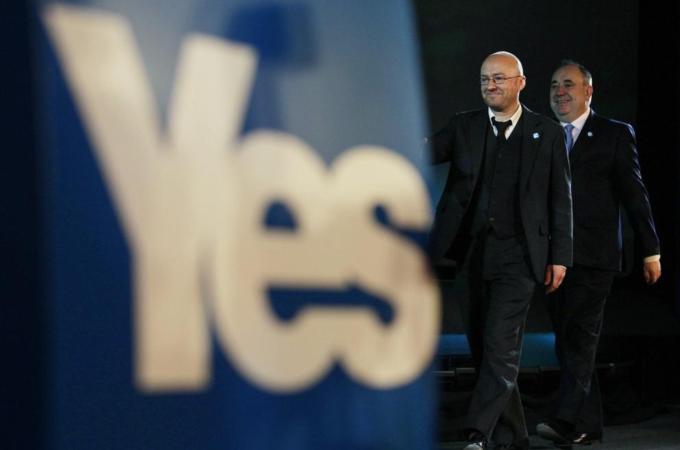 Scotland''s First Minister and leader of the SNP Alex Salmond walks on stage with Scottish Green Party leader Patrick Harvie in Edinburgh