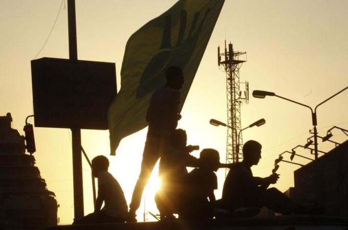 Members of the Muslim Brotherhood and supporters of ousted Egyptian President Mohamed Mursi form silhouettes during a protest near the El-Thadiya presidential palace in Cairo