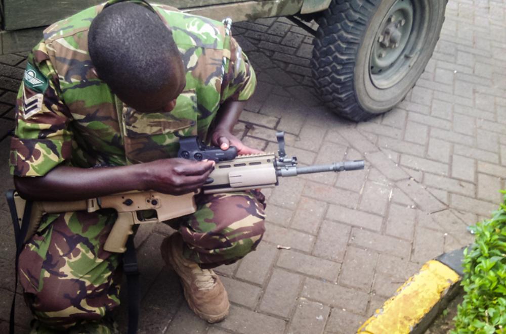 <p>A soldier prepares his kit before an assault on Al Shabab militants by the Kenyan military. The attackers from the Somalia-based group had barricaded themselves in a shopping centre and were suspected to have explosives.</p>