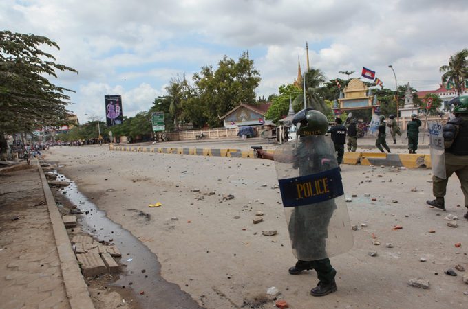 Riot police fired live ammunition, rubber pellets, and tear gas at the striking workers [Kara Fox/Al Jazeera]