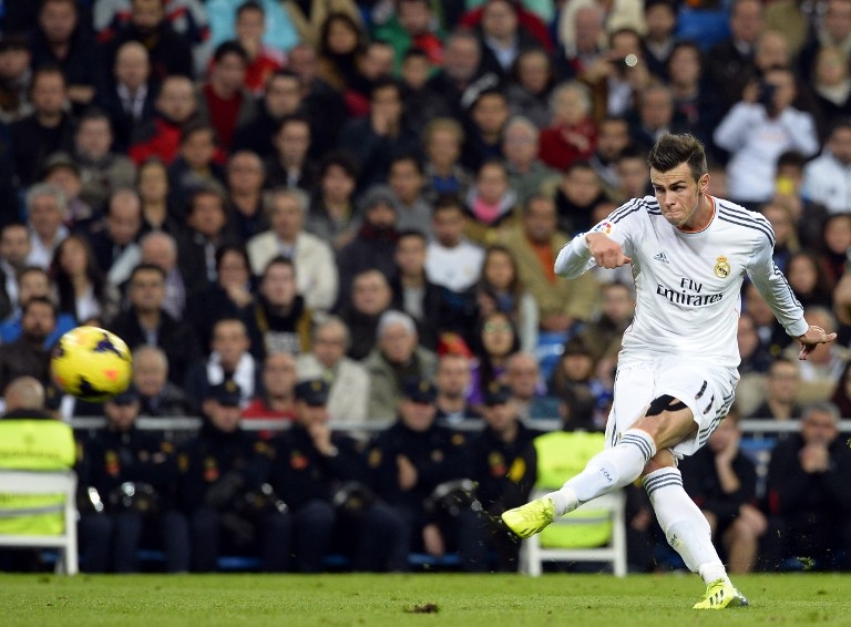 The world's most expensive footballer Gareth Bale scores his second goal for Real Madrid against Sevilla FC  [AFP]