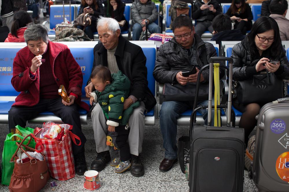 Despite improvements in the ticket sales system, people still have to wait hours to get on a train.