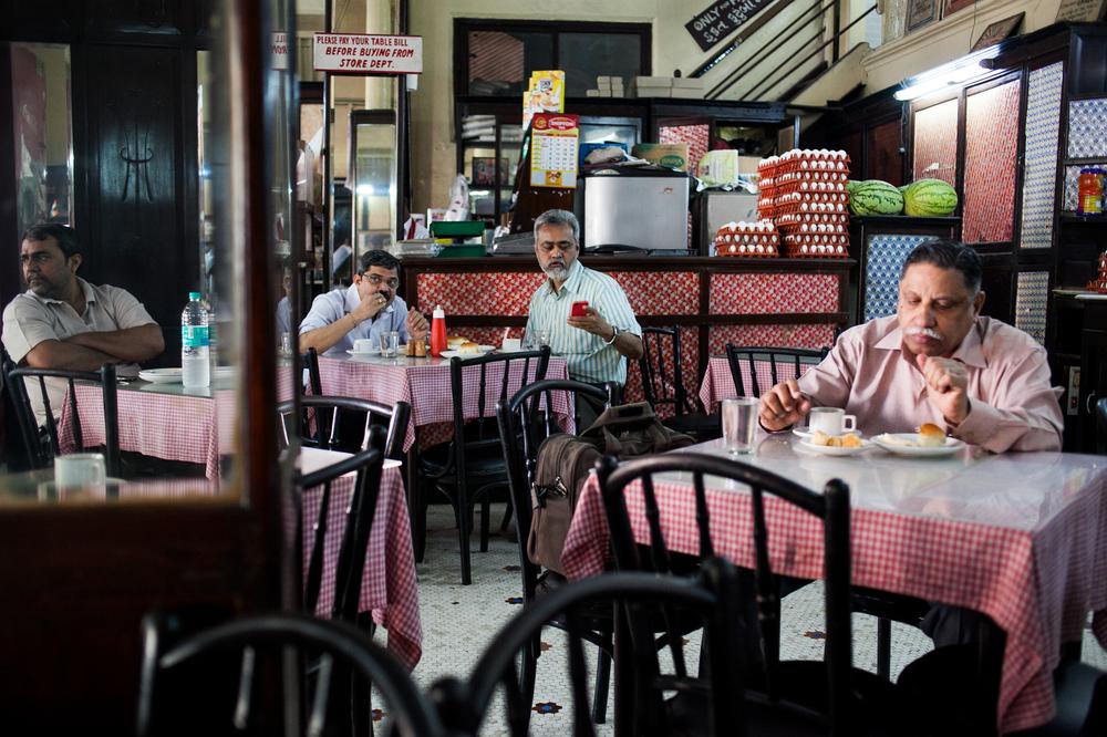 Customers have breakfast at Kyani & Co. which opened in 1904 and is the oldest operating Irani cafe in Mumbai