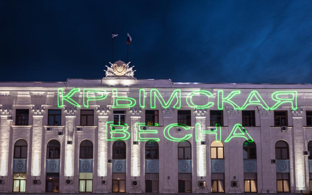<p>At night, the words (***)Crimean Spring(***) are projected onto a government building in Simferopol(***)s Lenin Square prior to a victory party amid exit polls suggesting at least 90 percent voted in favour of joining Russia.</p>