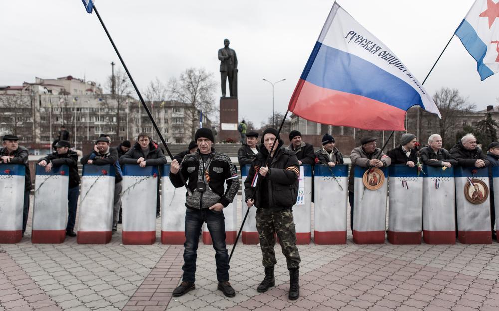 <p>Despite an uneasy calm, members of the "self defence forces" stand guard at certain points of the city.</p>