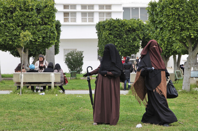 Some Tunisian women say restrictions on wearing the niqab would violate their religious rights [AP]
