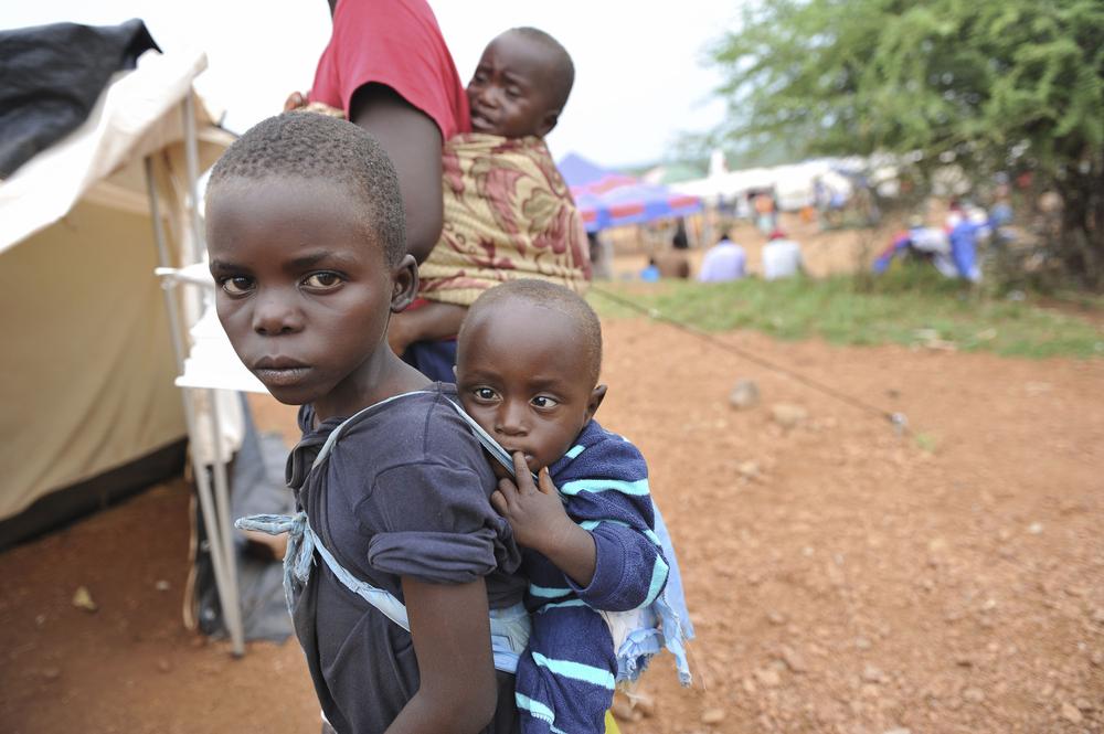 <p>Children wait for treatment outside Chingwizi camp(***)s only medical clinic, a makeshift hospital serving more than 20,000 people. </p>
