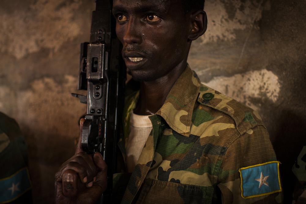 <p>A soldier in the Somali National Army learns to clean, assemble, and load a gun at the EU(***)s Jazeera Training Camp in Mogadishu, Somalia. The EU(***)s goal is to train the Somalis to train their own troops. However, with an underfunded military that is said to have been infiltrated by al-Shabab, progress remains slow.</p>