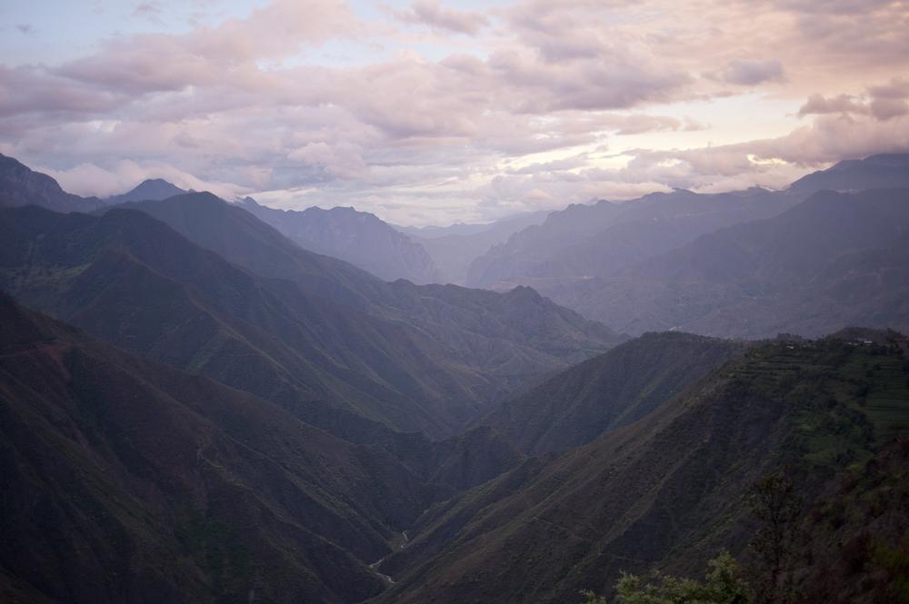 The scenery is spectacular  on the road from Lijiang to Lake Lugu in China's Yunnan province. Domestic tourism is booming here, on the borders of Tibet, Vietnam, Burma and Laos. [Dave Tacon/Al Jazeera]