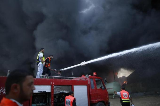 Firefighters succeeded in extinguishing a fire at Gaza's sole power station [Reuters]