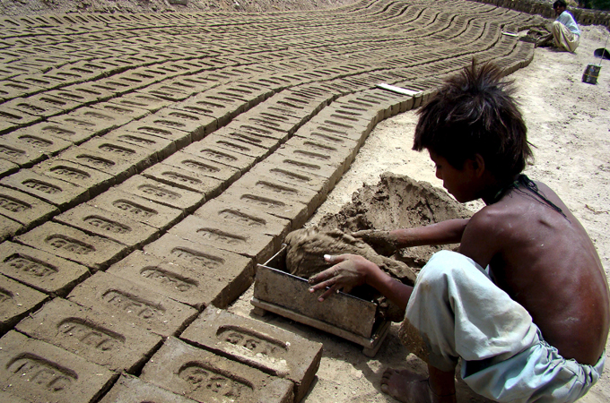 An estimated two million children keep the factories running, working under squalid conditions [EPA]