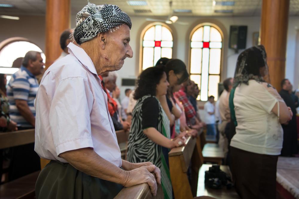 <p>An elderly Christian man attends mass at Saint Joseph(***)s Chaldean Catholic Church in Erbil on June 27. Thousands of Christians have fled to areas controlled by the Kurdistan Regional Government (KRG) since the Islamic State group(***)s takeover of Mosul in June.</p>