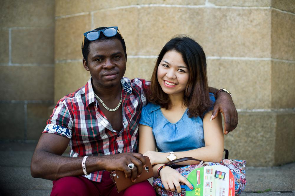 <p>(***)Fine(***), a Nigerian who declined to give his last name and his Chinese girlfriend pose outside the Sacred Heart of Jesus Cathedral. Some African migrants are able to operate businesses through Chinese partners, although permanent residency is almost impossible to acquire.</p>