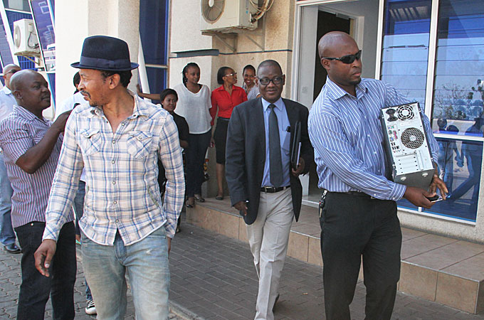 Newspaper editor Outsa Mokone after security agents raided his offices [Victor Baatweng/Al Jazeera]