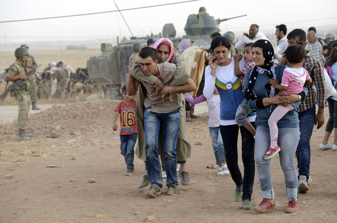 Around 160,000 civilians have fled the town of Ain al-Arab and its surrounding area for Turkey [Reuters]