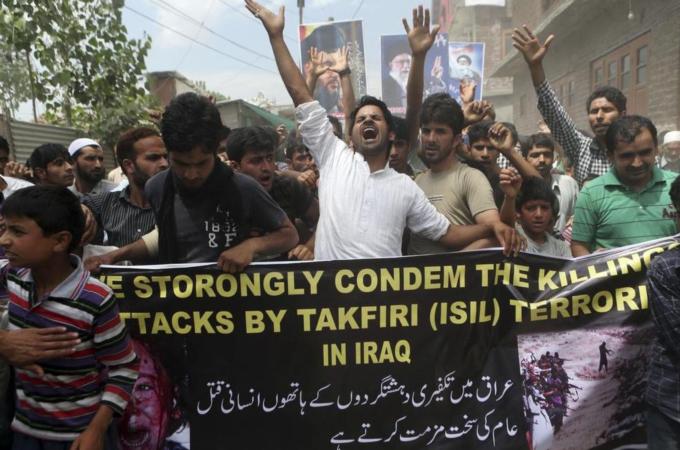 Kashmiri Muslims shout anti-US and anti-Israel slogans during a protest on the outskirts of Srinagar [AP]