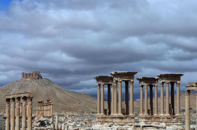 The monumental entrance of the ancient oasis city of Palmyra, northeast of Damascus [AFP]