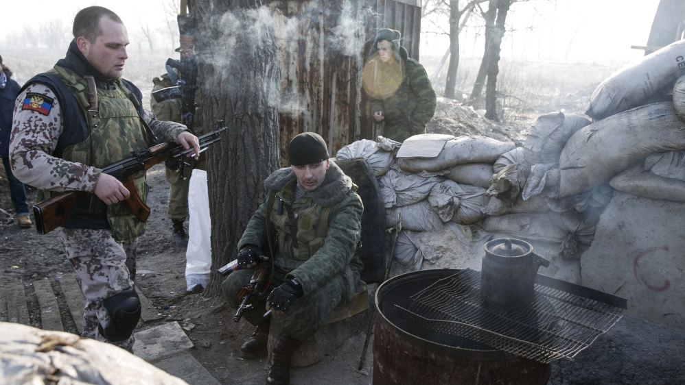 Members of the armed forces of the separatist self-proclaimed Donetsk People''s Republic rest at a checkpoint near Donetsk