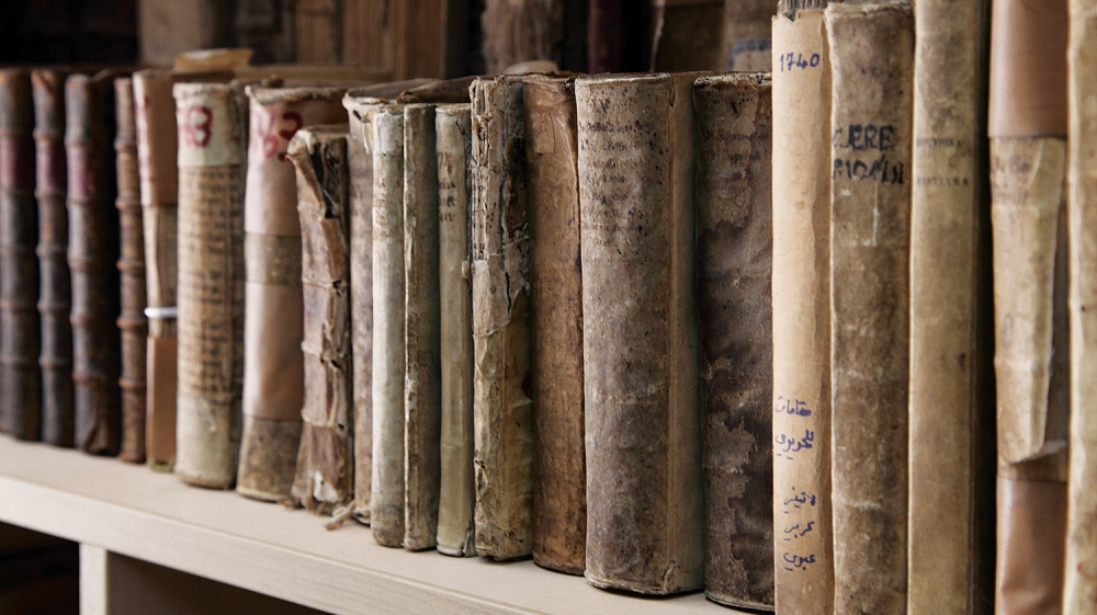 Books rescued from Mosul at the Dominican Priory in Qaraqosh, Iraq, are displayed [AP]