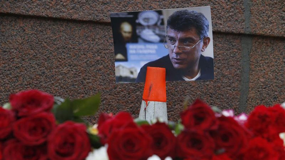 A photo and flowers were placed at the site where Boris Nemtsov was shot dead, near the Kremlin in central Moscow [Reuters]
