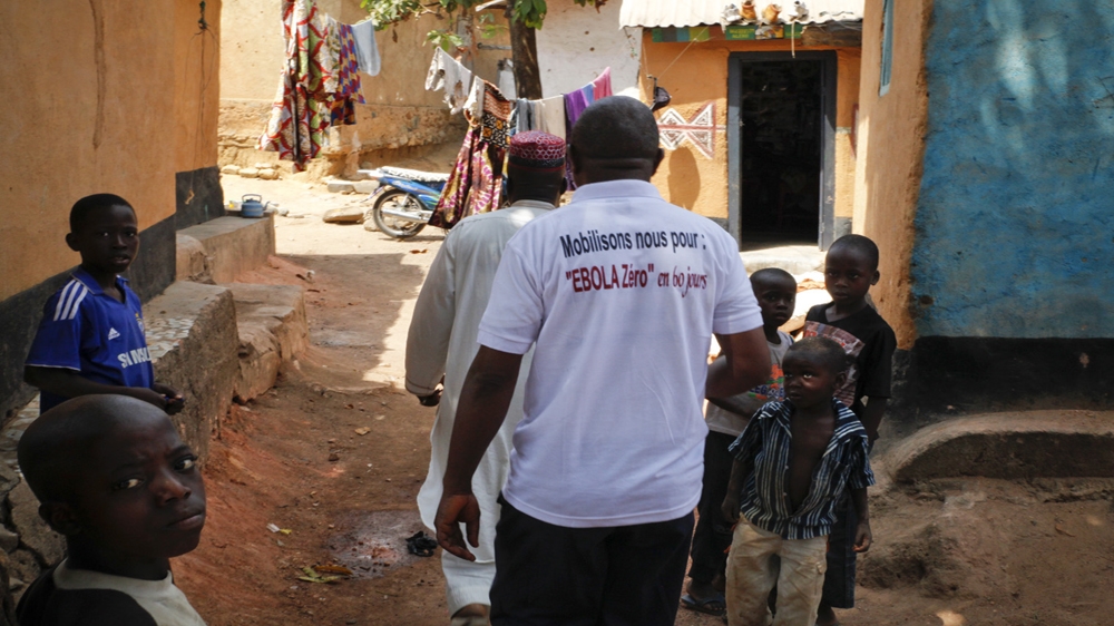 Christian and Muslim traditional healers work together to spread the message on how to protect against Ebola [Misha Hussain/Thomson Reuters Foundation]