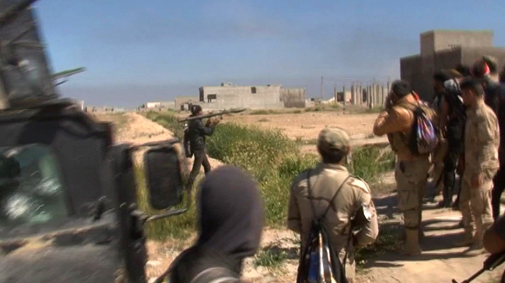 A soldier fires a rocket propelled grenade (RPG) in Tikrit, Iraq on Wednesday [AP]