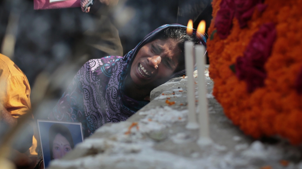 Bangladeshi relative of a victim cries in front of a monument erected in memory of the victims of Rana Plaza building collapse [AP]