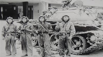 A picture of a photo of the North Vietnamese tank unit which barrelled thorough the gates of Saigon's Presidential Palace on April 30, 1975, and raised the North Vietnamese flag over the building