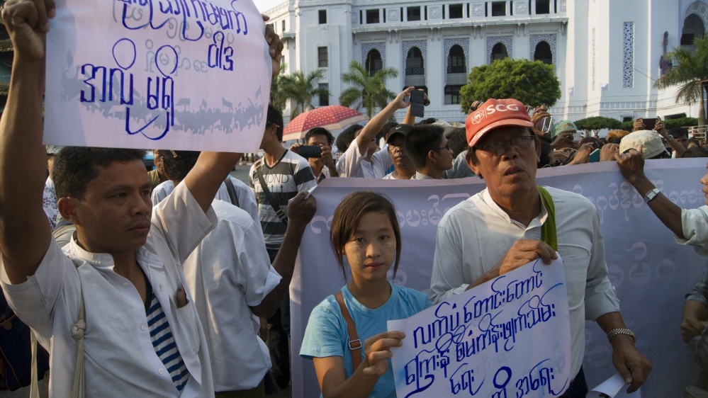 Myanmar activists march to commemorate the anniversary of a crackdown on protesters occupying Letpadaung copper mine [AP]
