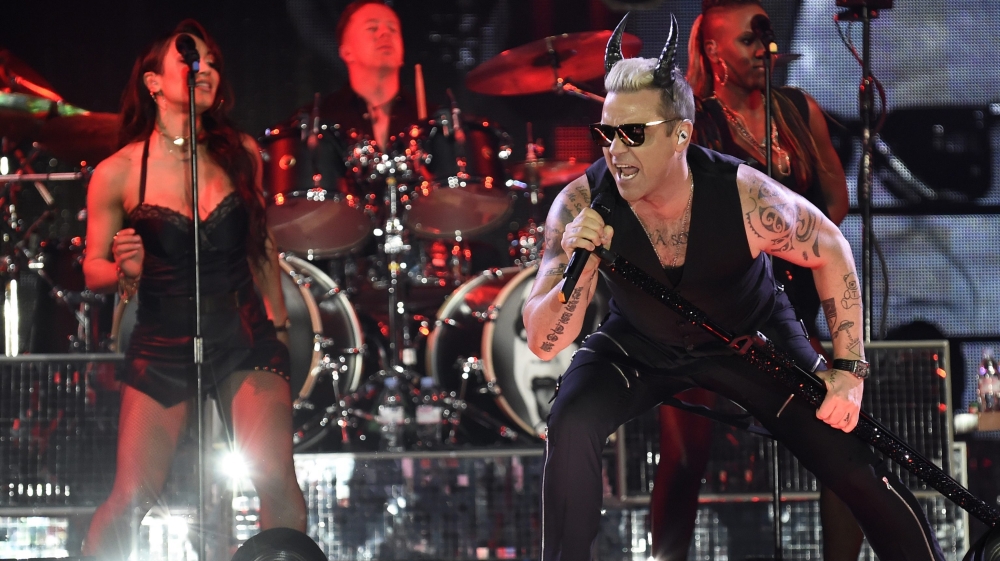 British singer Robbie Williams performs during a concert in Linz, Austria [EPA]