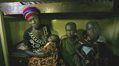 Delphin Nyiyanwi waits aboard the MV Liemba for the body of her 4-year-old son [Jessica Hatcher]