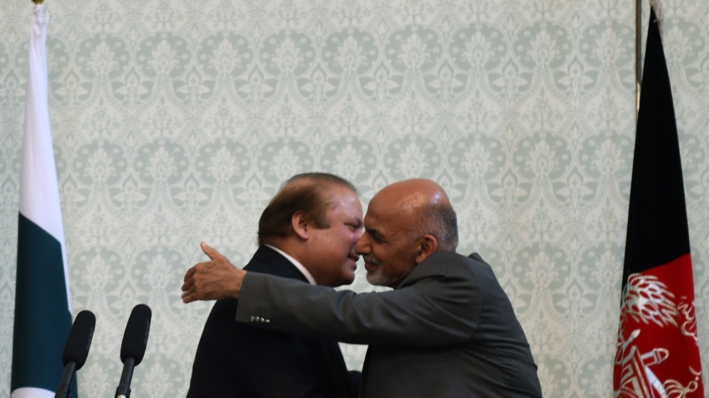 Afghan President Ashraf Ghani embraces Pakistani Prime Minster Nawaz Sharif at the Presidential palace in Kabul [AFP]