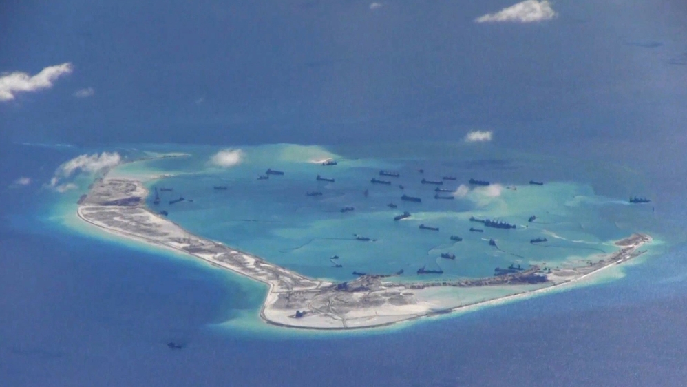 File still image from United States Navy video purportedly shows Chinese dredging vessels in the waters around Mischief Reef in the disputed Spratly Islands