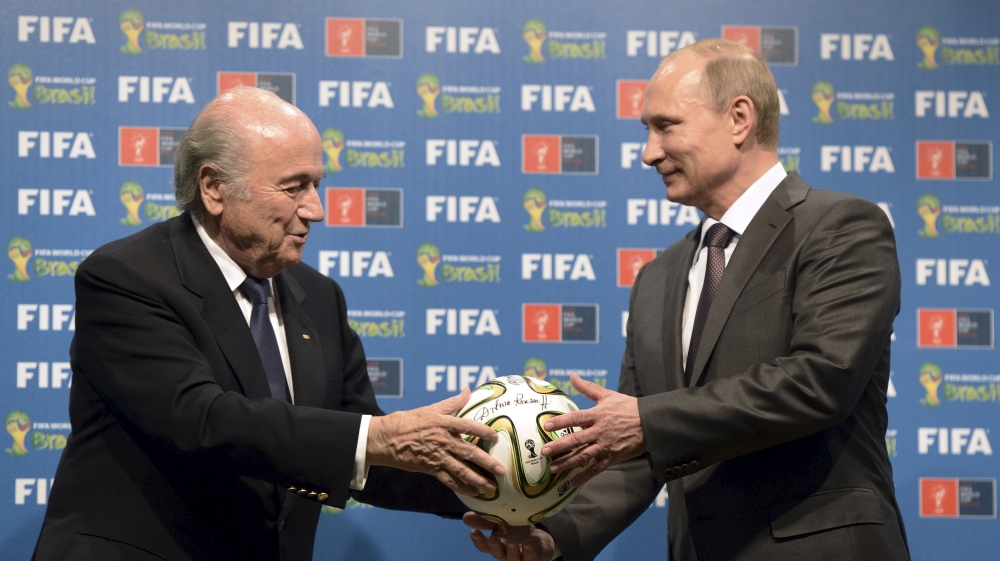 File picture of Russian President Putin and FIFA President Blatter taking part in the official handover ceremony for the 2018 World Cup in Rio de Janeiro